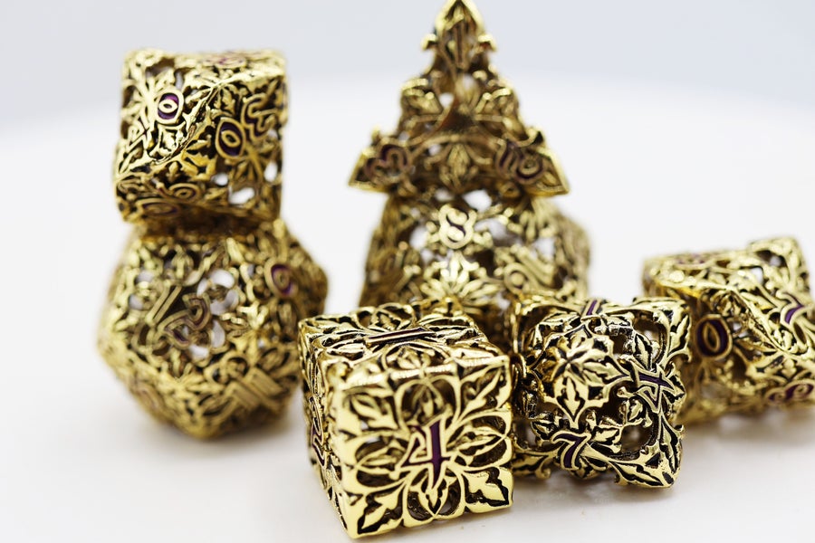 Fleur de Lis: Gilded Amethyst Hollow Metal RPG Dice Set